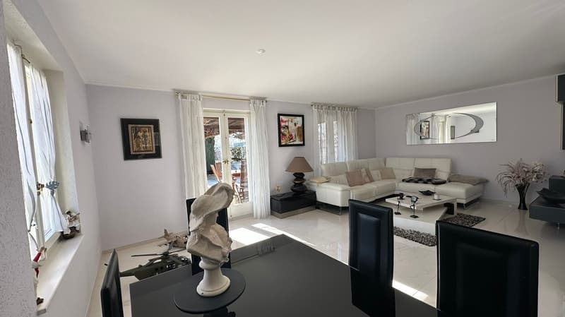 white walls, white sofa, white curtains, white tile floor, black chairs, white table, white statue, white lamp, white coffee table, white mirror, white picture frames, white window