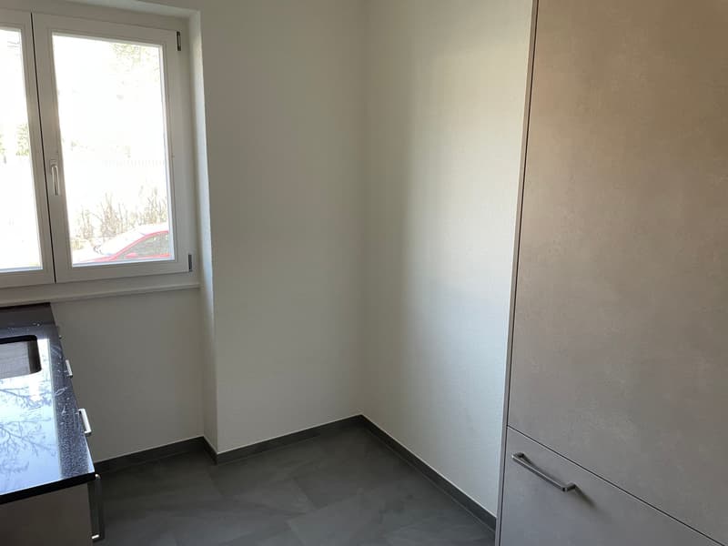 empty room, tile flooring, small window, open closet, countertop with sink