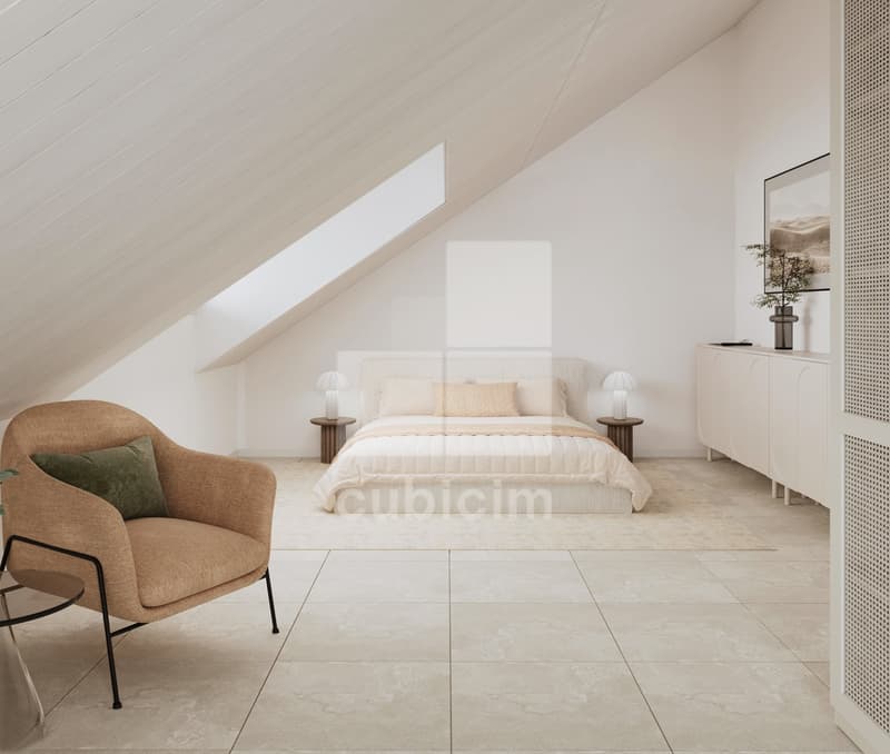 Spacious bedroom with slanted ceiling, large windows, white walls, beige bedding, wooden nightstands, and a brown armchair.