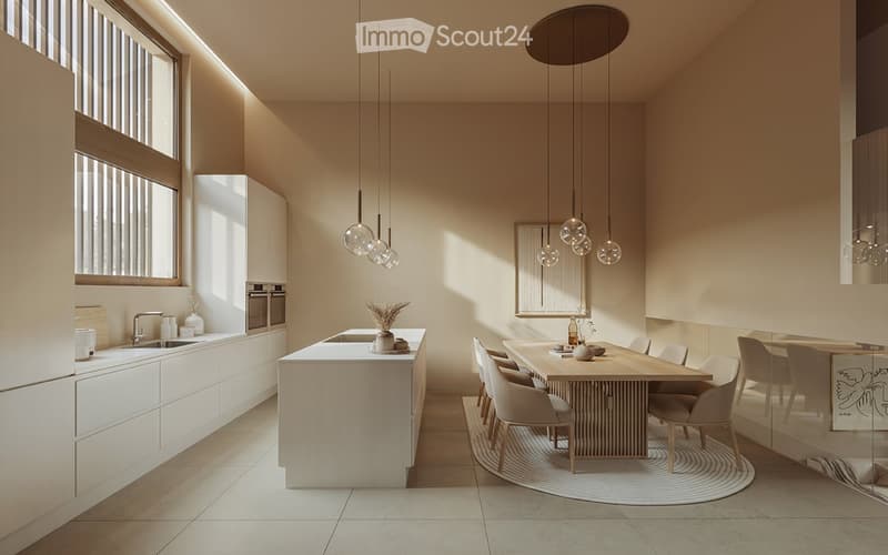 Spacious open-concept kitchen and dining area with modern, minimalist design. The kitchen features a large white island with built-in appliances, including a dishwasher. The dining table is made of wood and surrounded by comfortable chairs. Pendant lighti