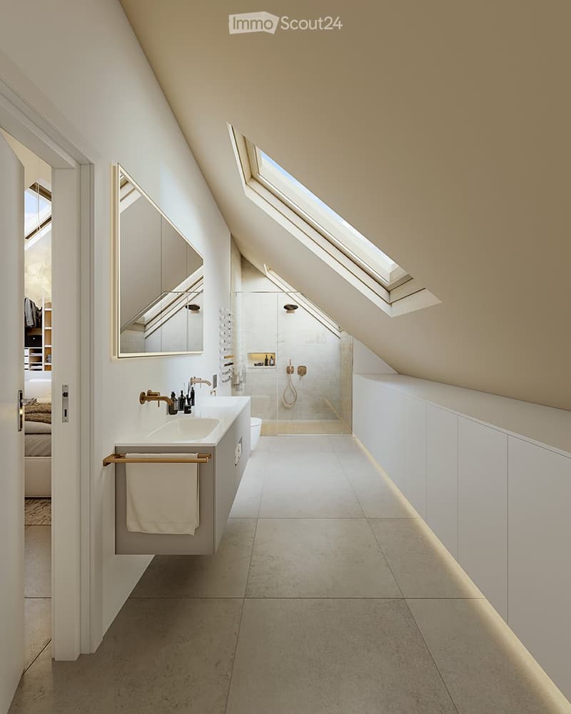 Spacious bathroom with slanted ceiling, large skylight windows, white vanity with sink, and tiled flooring.