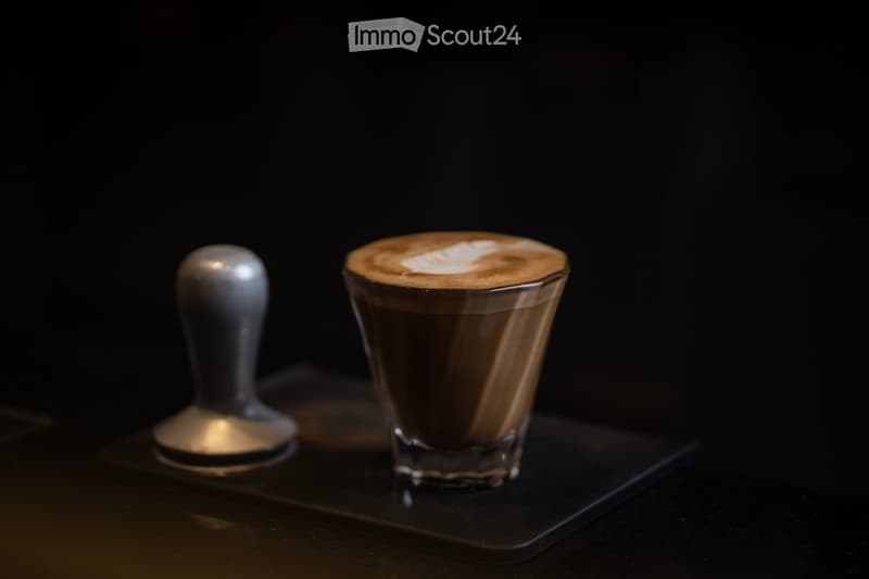 Chocolate latte with a foam design on top.