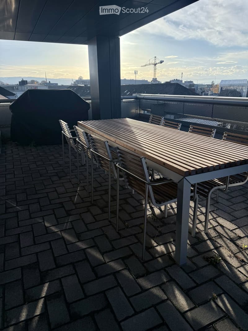 outdoor dining table and chairs, brick floor, city view, covered grill