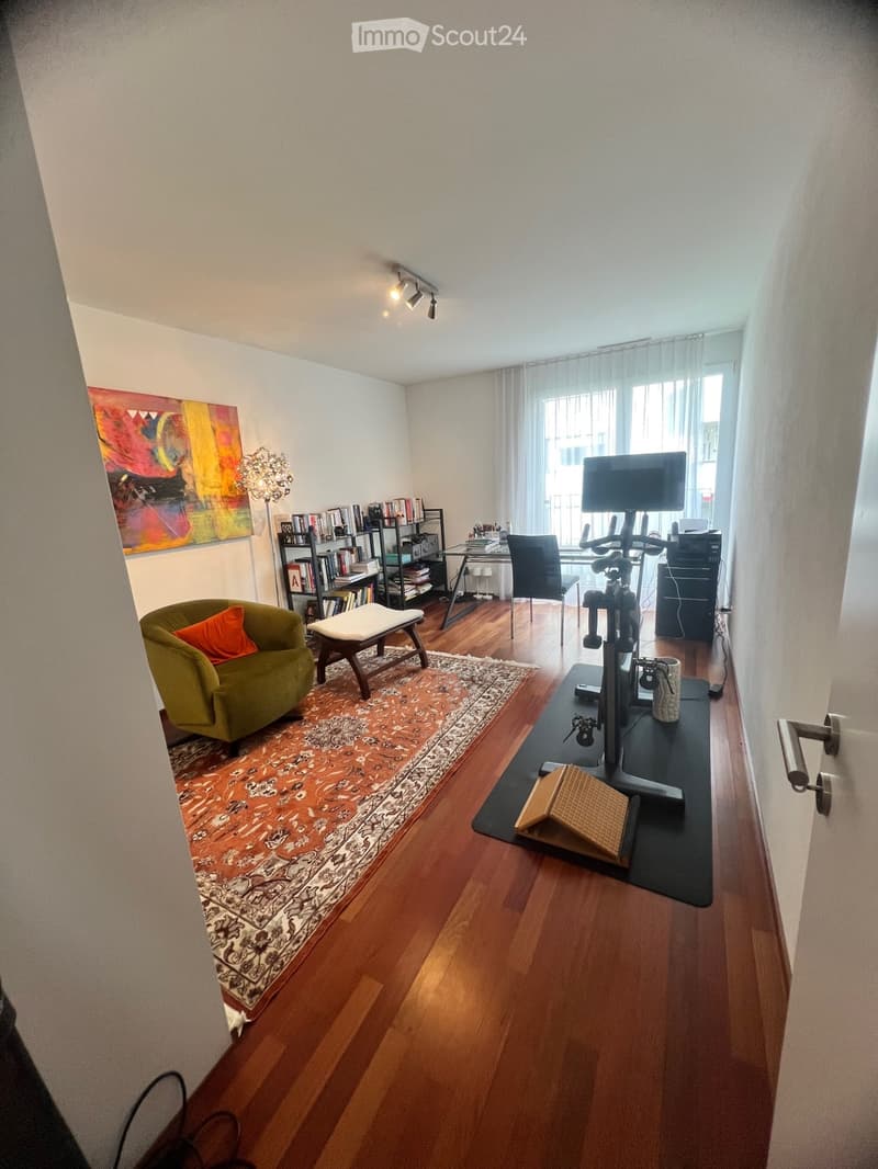 large window, wooden floor, modern decor, living room furniture, exercise bike