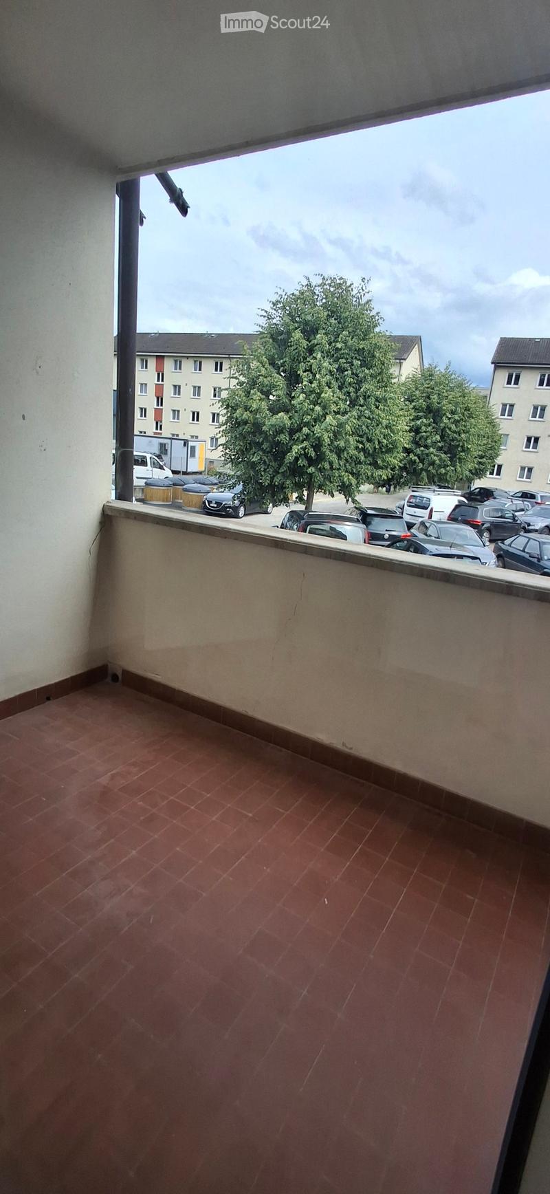 terraced balcony, tile floor, large window