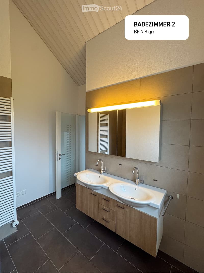 bathroom with two sinks, mirror, wooden cabinet, radiator, tiled floor