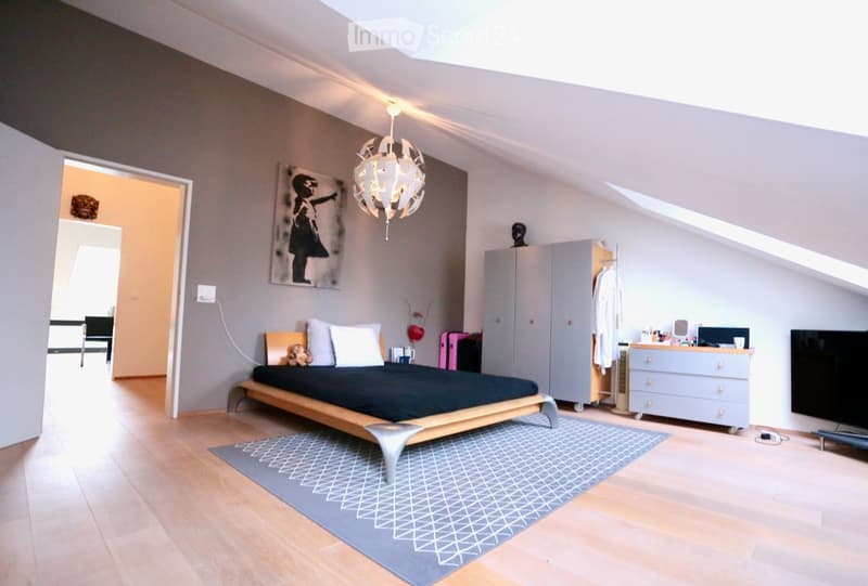 Wooden floor, gray walls, chandelier, bed, wardrobe, nightstand, TV