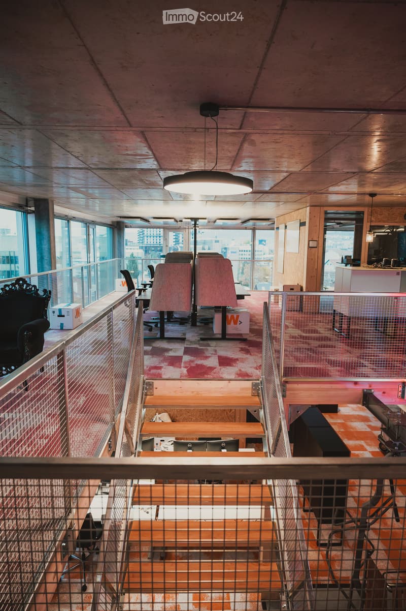 modern office design, industrial ceiling, large windows, wooden stairs, workstations, office chairs, storage boxes, railings