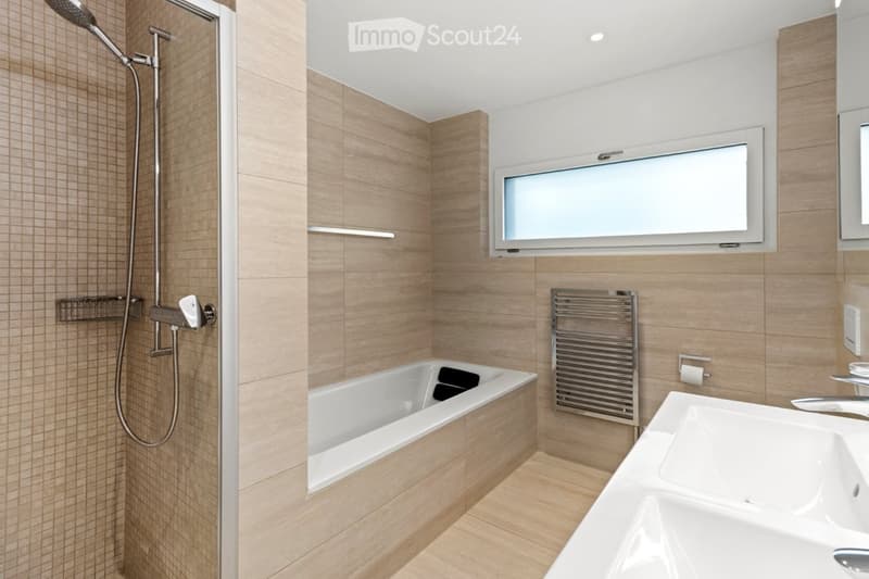 Bathroom with shower, bathtub, sink, radiator, tiled walls, and a window