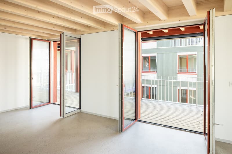 open doors leading to balcony, wooden ceiling