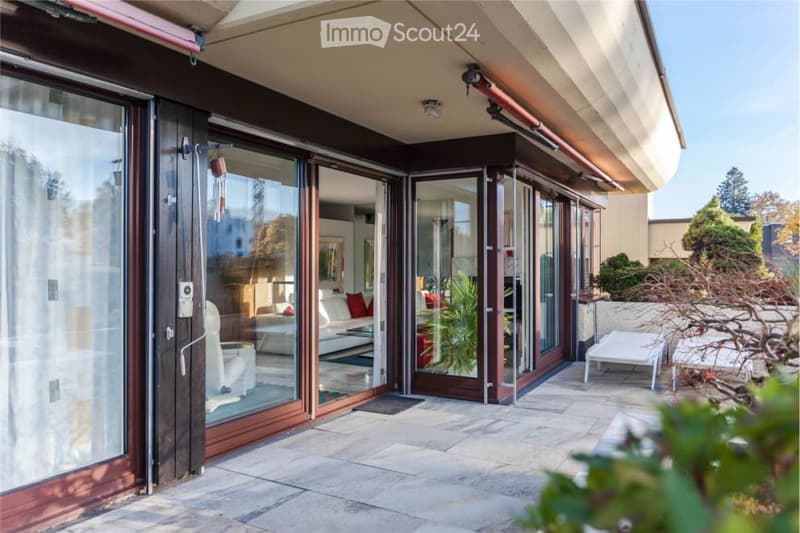 outdoor seating area with tables, cushioned chairs, potted plants, sliding glass doors