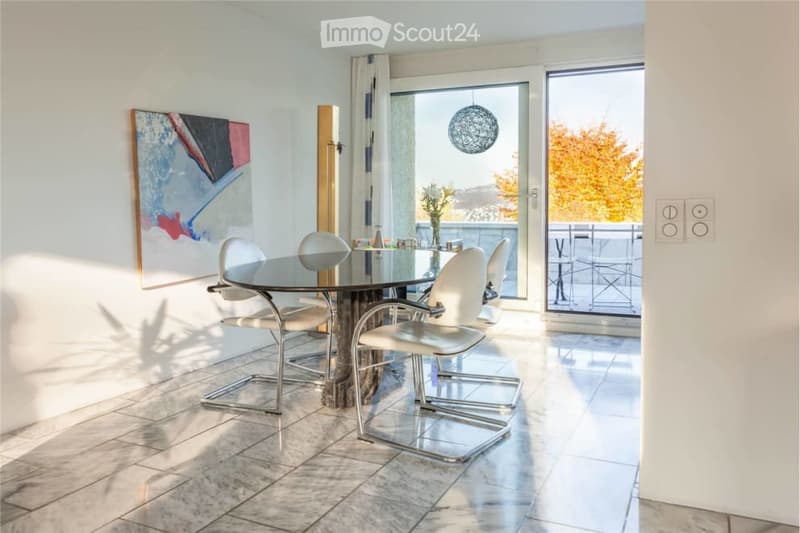 marble floor, round table, 6 chairs, white walls, windows, artwork, and a door to the terrace
