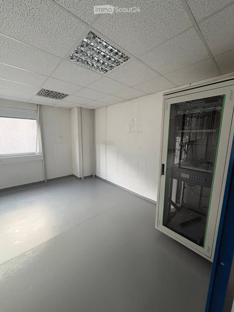 empty room, white walls, gray floor, window, server rack