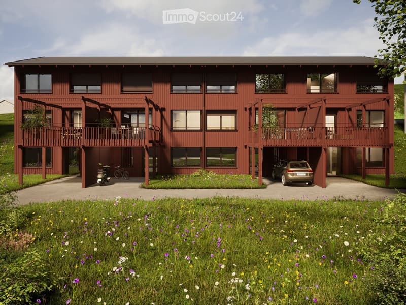 2 story house, red exterior, multiple balconies, garage, bicycles parked