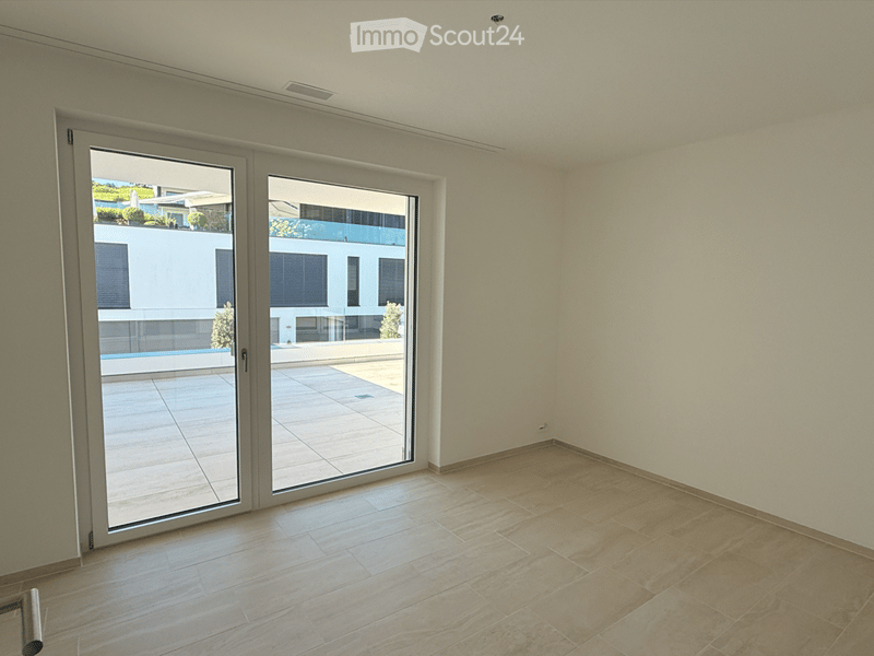 empty room, sliding glass doors, balcony, tiled floor, white walls
