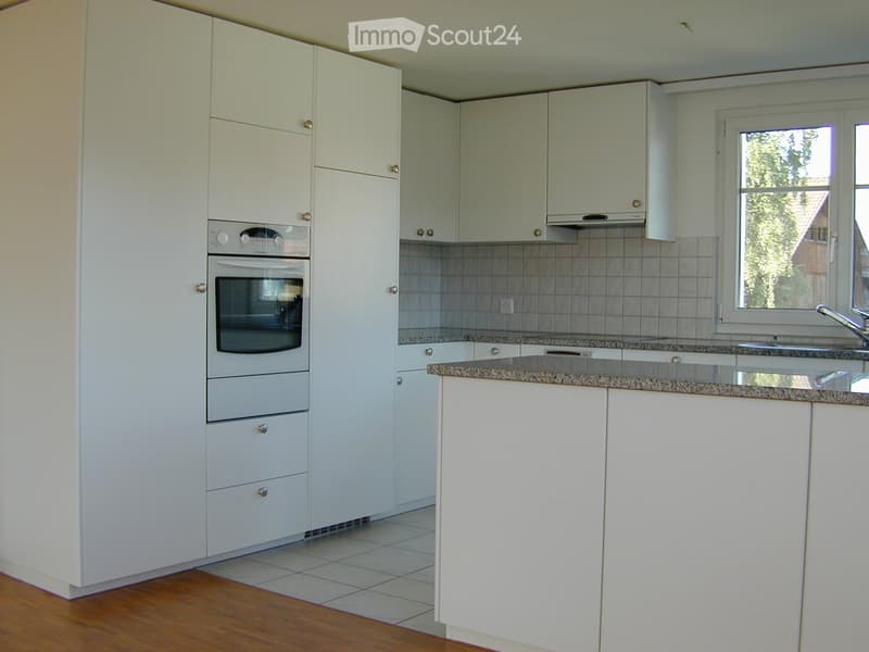 modern kitchen, white cabinets, granite countertop, built-in oven and dishwasher, sink with faucet, tiled floor