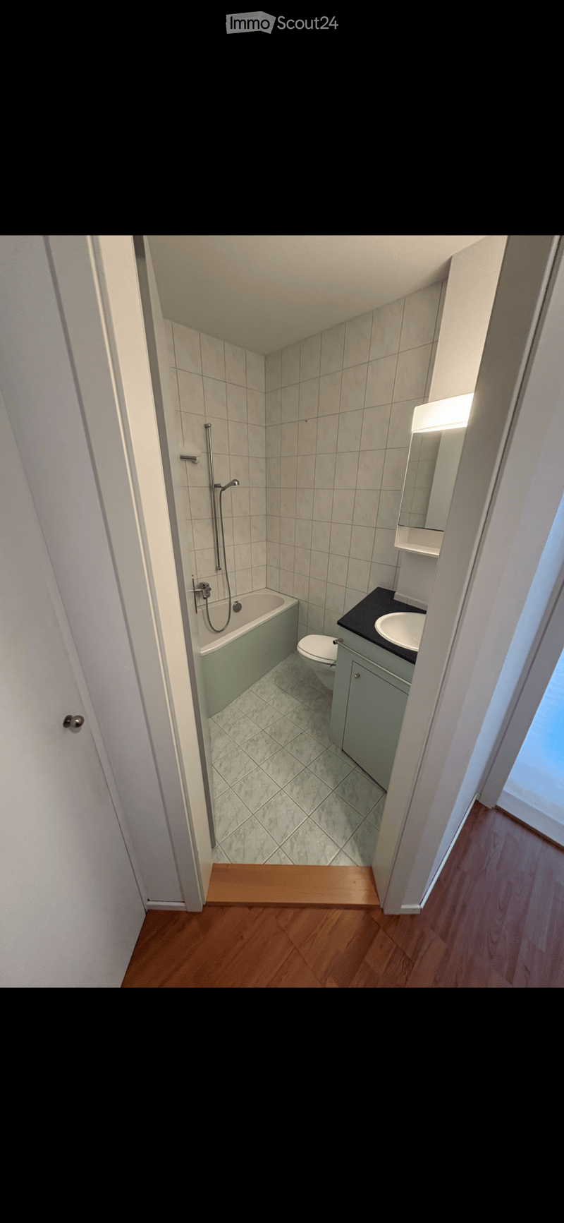 Bathroom with bathtub, toilet, sink, mirror, and shower