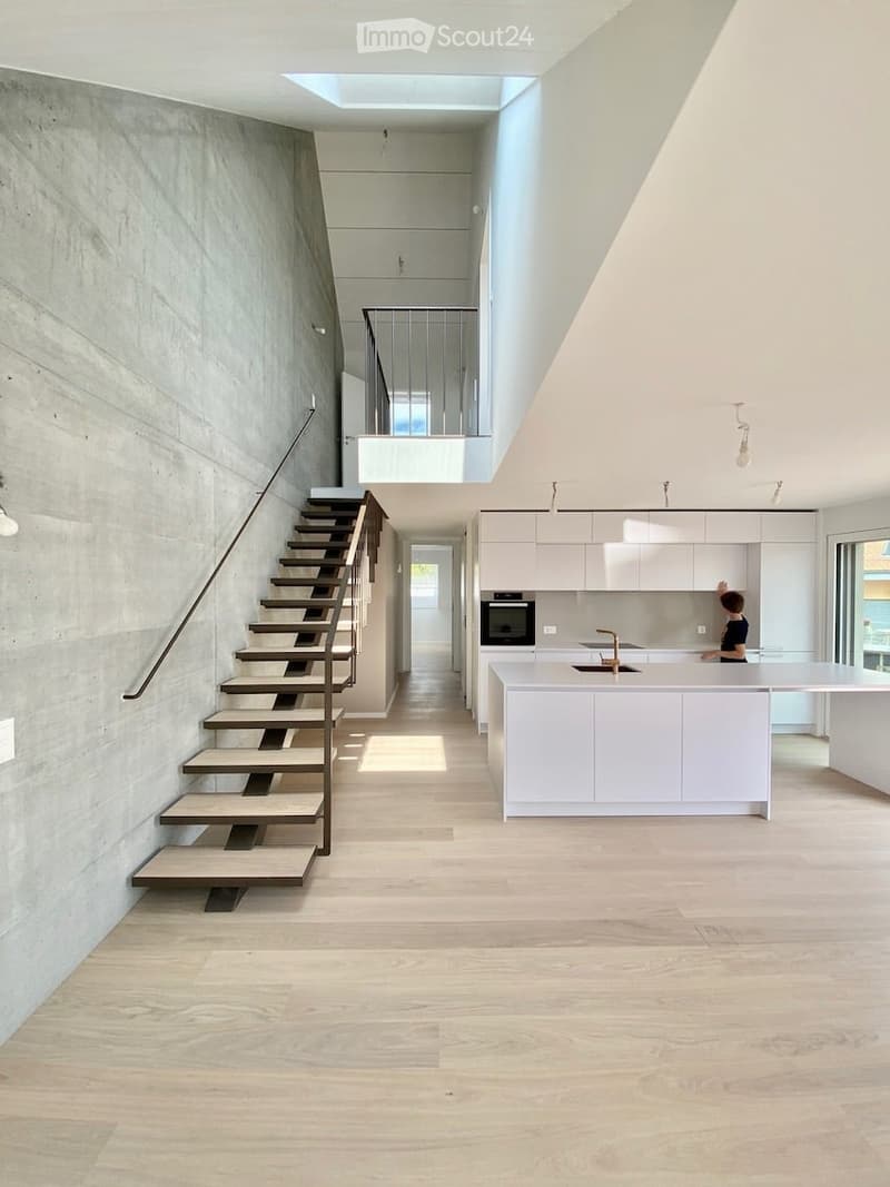 {"visible_features": ["Raised ground floor"],    "type": "Interior",    "description": "modern interior, concrete wall, wooden floor, white kitchen, staircase, balcony",    "localized_descriptions":        {        "EN": "modern interior, concrete wa