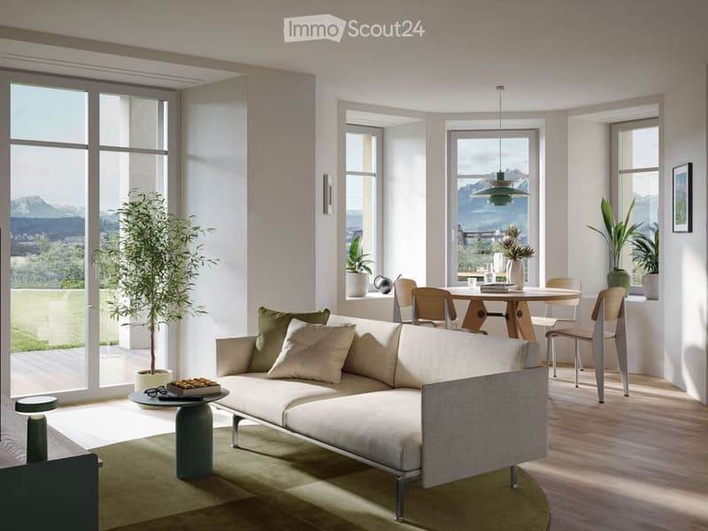 modern living room with large windows, beige sofa, wooden floor, round rug, table, chairs, plants, lamp