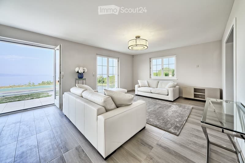 modern living room with white leather sofas, glass table, large windows, balcony, tiled floor, ceiling lamp