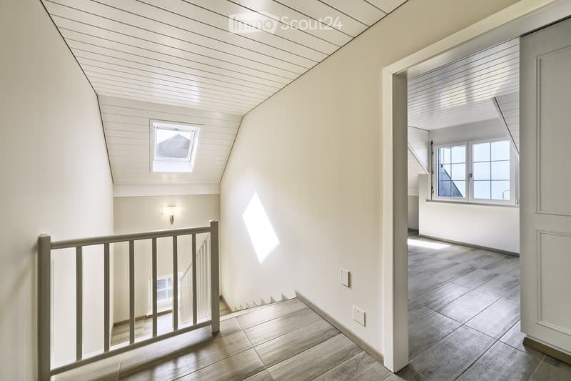 white walls, wooden floor, white ceiling, windows, staircase