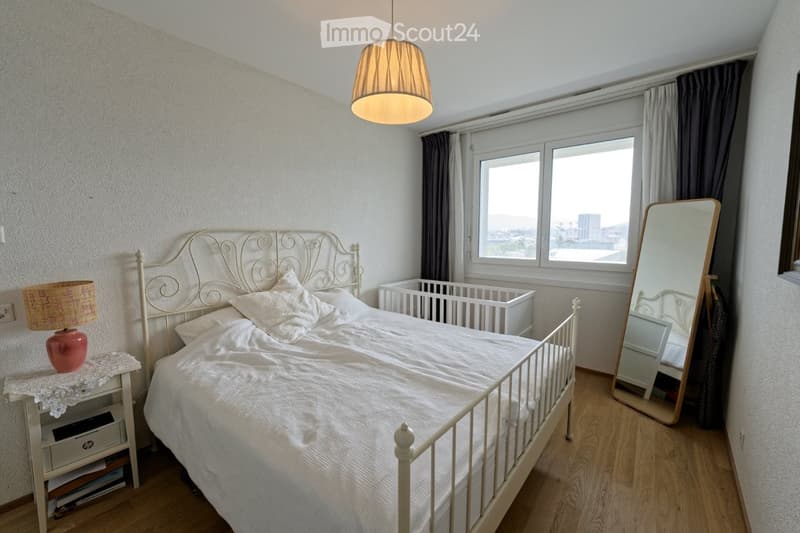 white bed, white nightstand, lamp, mirror, crib, window, curtains