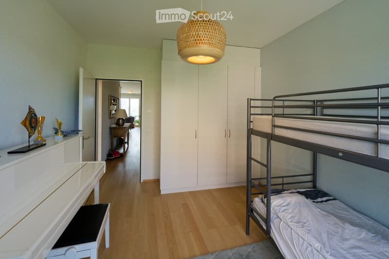 white piano, white cabinet, white bunk bed, white wardrobe, wooden floor, lamp