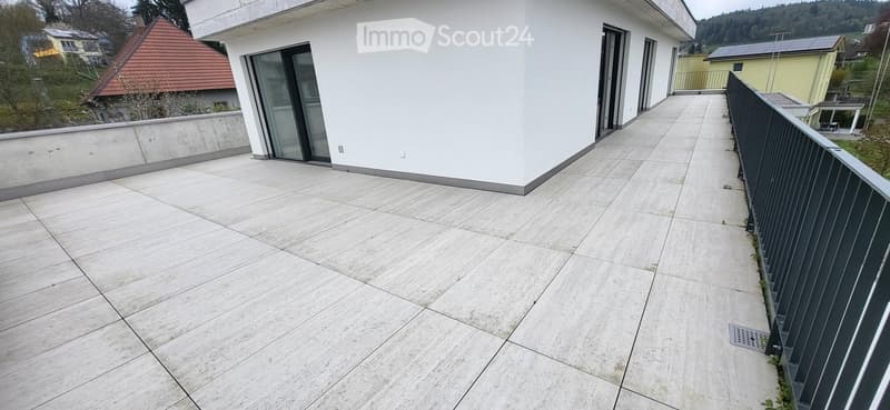 tiled floor, black railing, glass doors, white walls