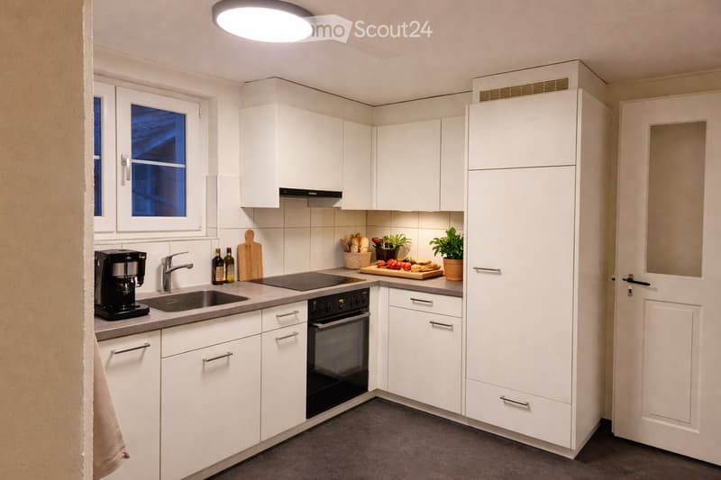 modern kitchen with white cabinets, granite countertops, black appliances, and a window