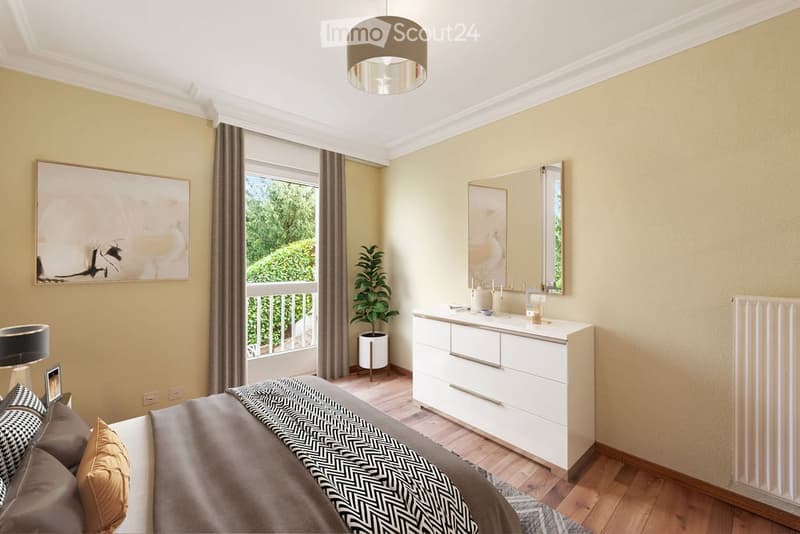 Bedroom with bed, white dresser, mirror, balcony, potted plant, artwork, lamp, radiator