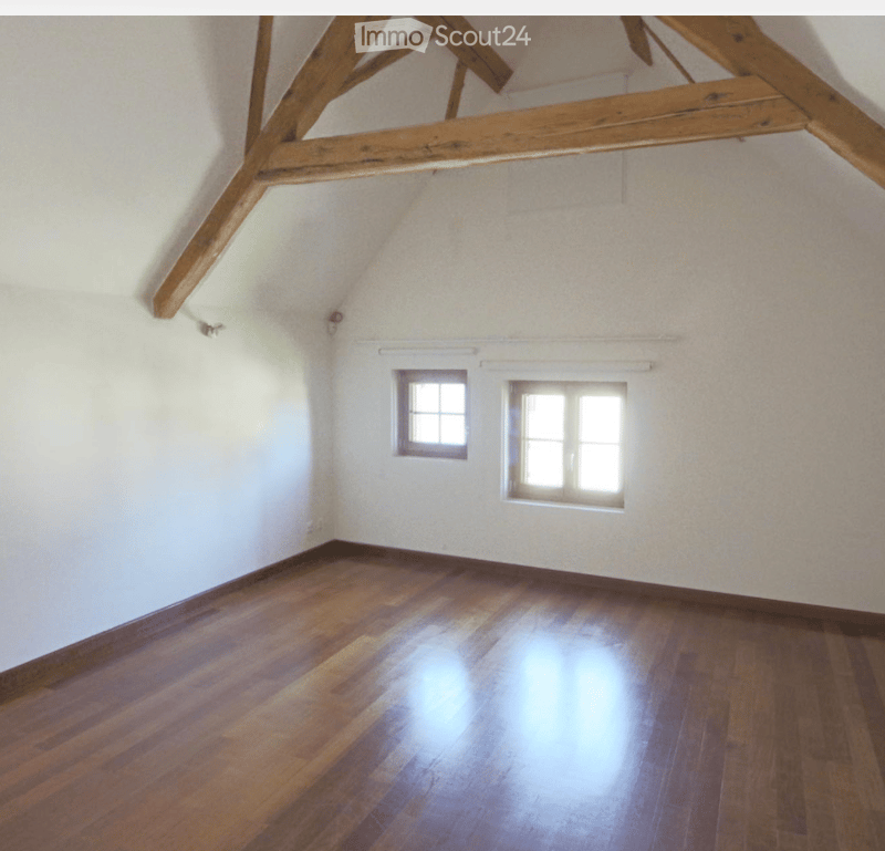 empty room, wooden floor, wooden beams, two windows