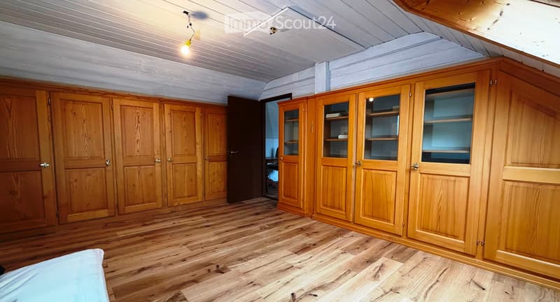 wooden floor, wooden cabinets, wooden beams ceiling, open door