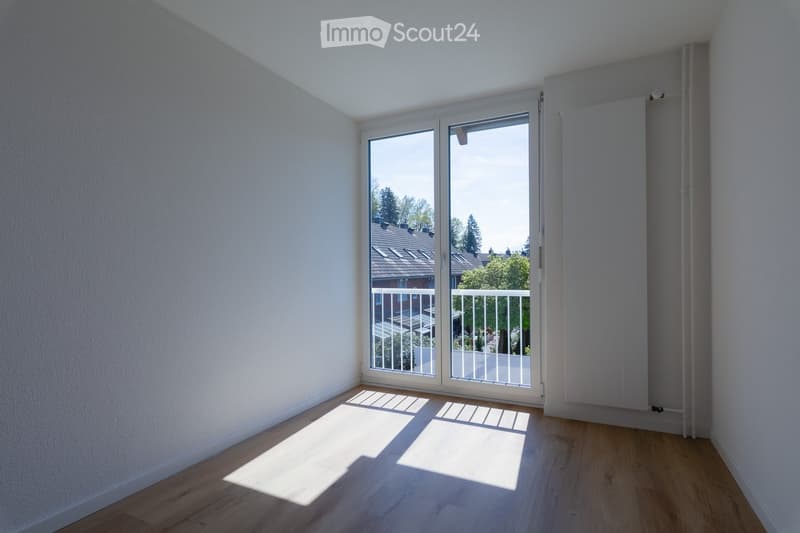 empty room, white walls, wooden floor, sliding glass door, balcony