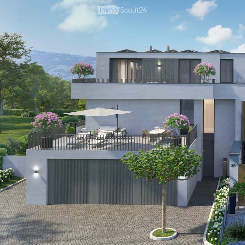 Modern two-story house with a garage, outdoor seating area, and a balcony with a large umbrella.