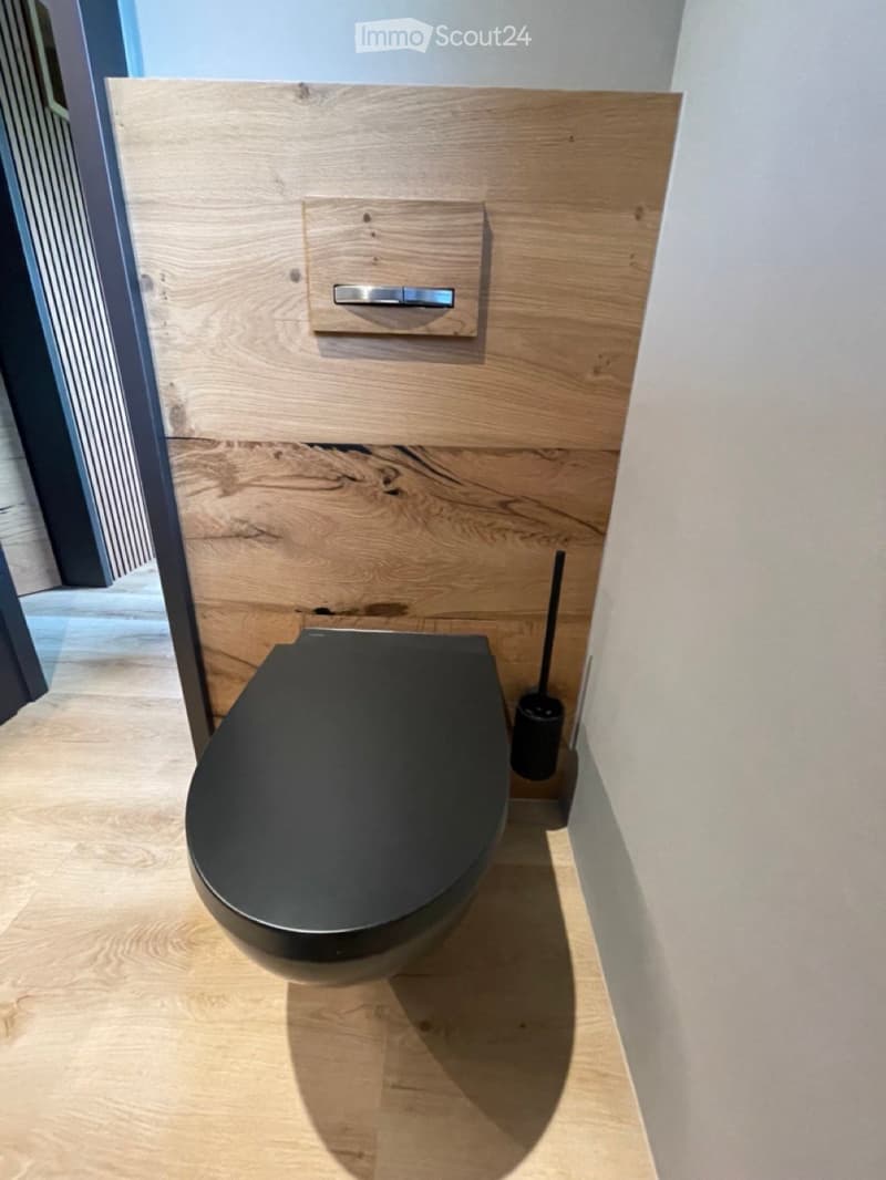 bathroom: modern toilet, wooden wall, floor