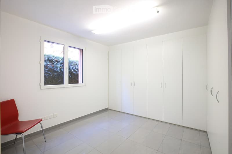 empty room, white walls, built-in wardrobes, window, tiled floor, ceiling light