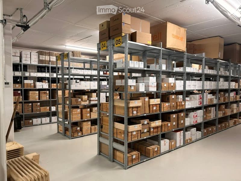 Other. Warehouse with metal shelving units filled with cardboard boxes and storage items.