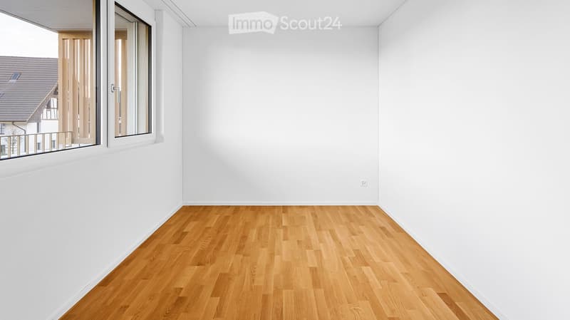 Unfurnished Room. Completely empty room with bare white walls and wooden floor. No furniture or equipment.