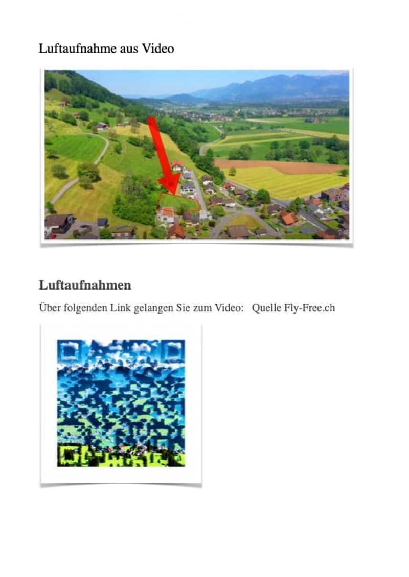 Aerial view of a rural area with houses, fields, and mountains in the background. A red arrow points to a specific house.