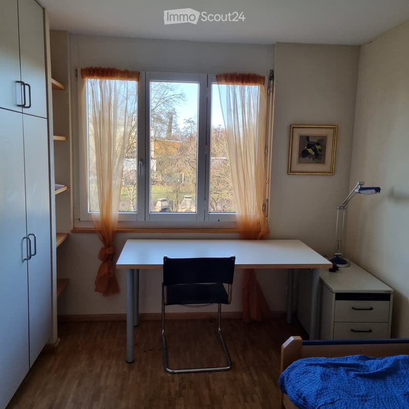 Desk, chair, bed, wardrobe, picture frame, lamp, window with curtains