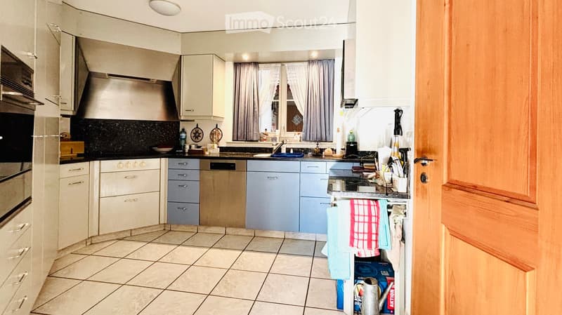 modern kitchen with white cabinets, granite countertops, stainless steel appliances, dishwasher, window with curtains