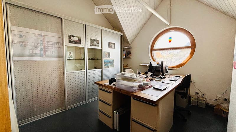 desk, computer, chair, shelves, round window