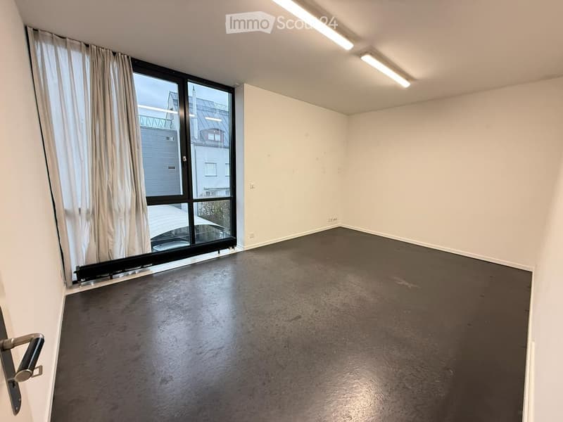 empty room, white walls, black floor, large window, white curtains