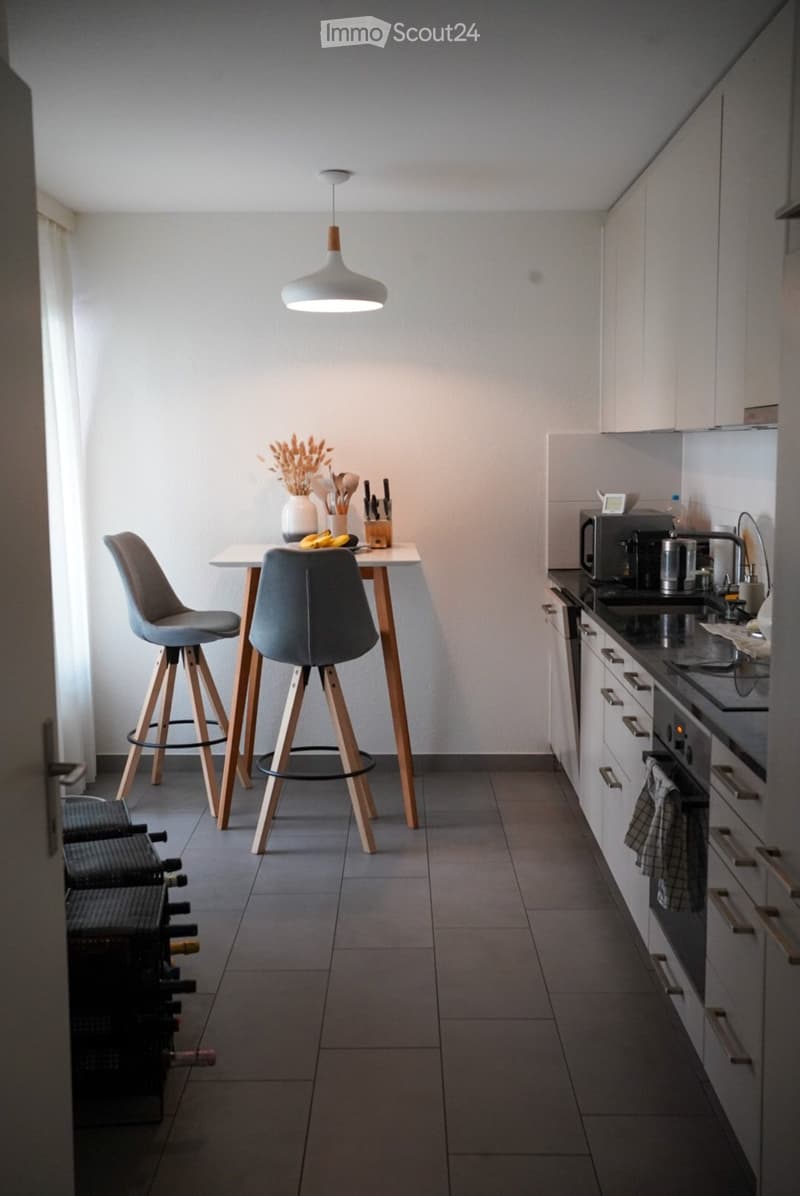 {"type": "Kitchen", "objects": ["stool", "stool", "table", "vase", "oven", "microwave", "faucet", "cupboard", "cupboard", "cupboard", "cupboard", "cupboard", "cupboard", "cupboard", "cupboard", "cupboard", "cupboard", "cupboard", "cupboard", "cupboard", "