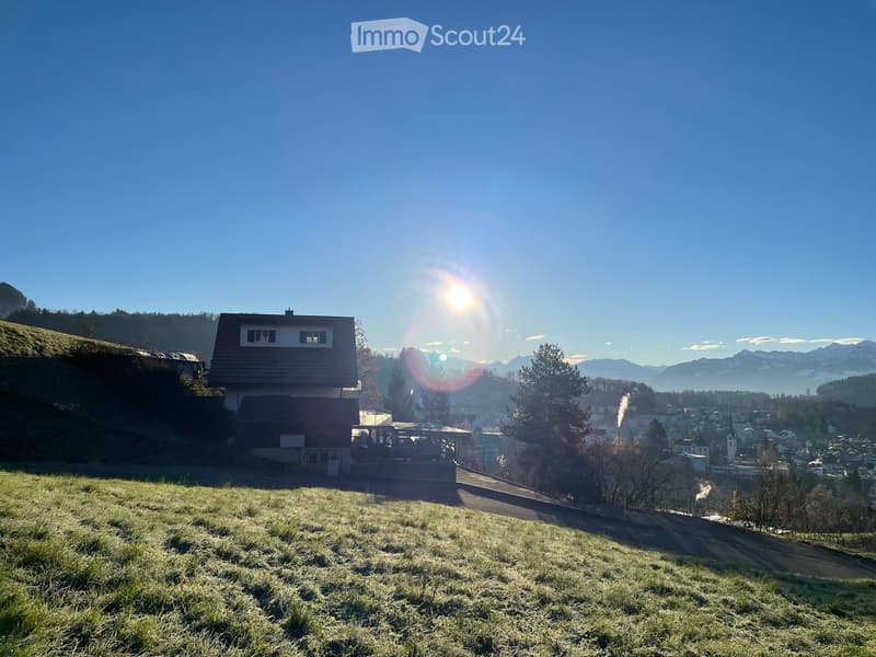 House on hill with mountain view