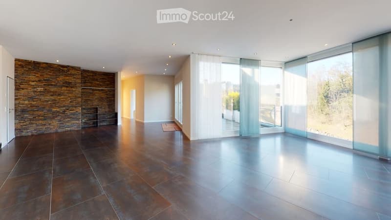 tiled floor, large windows, glass doors to balcony, stone wall