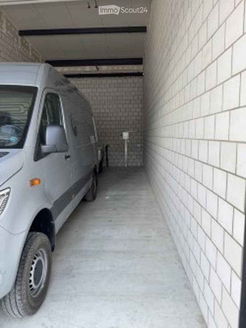 {"type": "Garage", "objects": [], "description": "A clean, well-lit garage with a parked van, white brick walls, and a concrete floor.", "visible_features": ["Garage"], "localized_descriptions": {"EN": "A clean, well-lit garage with a parked van, white br