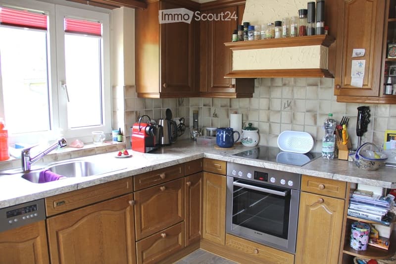 {"type": "Kitchen", "objects": ["sink", "faucet", "oven", "dishwasher", "coffee maker", "cup", "bottle", "oven", "cupboard", "fridge", "cupboard", "cupboard", "cupboard", "cupboard", "cupboard", "cupboard", "cupboard", "cupboard", "cupboard", "cupboard",