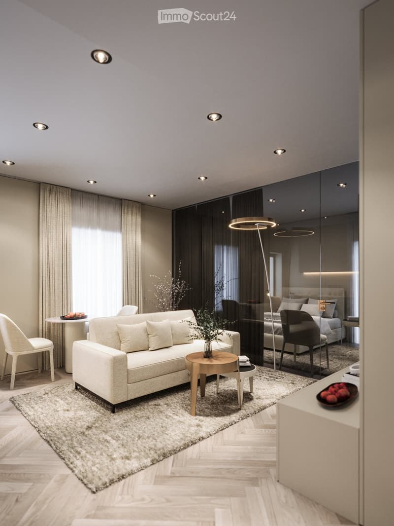 modern living room with a white couch, carpet, side table, floor lamp, armchair, and a glass wall leading to a bedroom