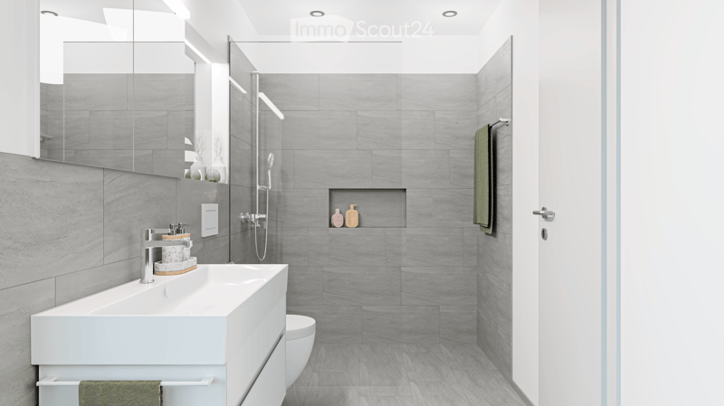 modern bathroom, gray tiles, white vanity, shower with glass enclosure, green towel hanging, sink with faucet and toiletries